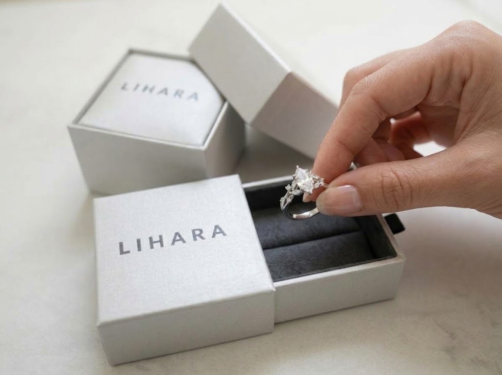 A silver preview ring lifted from its Lihara box