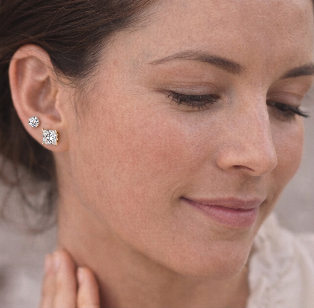Princess cut diamond studs on ear