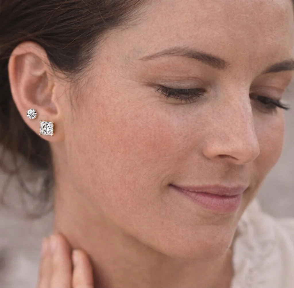 Princess cut diamond studs on ear